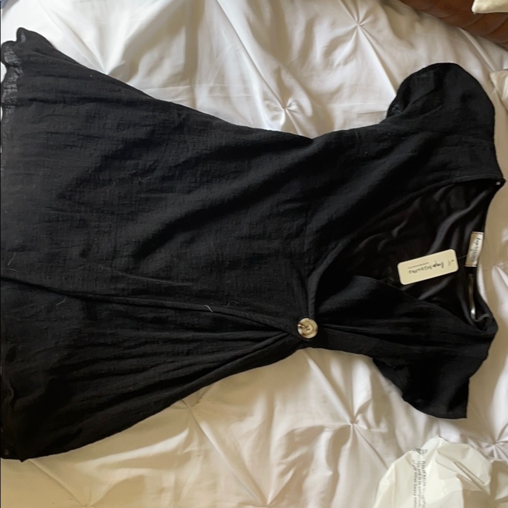 Black mini dress with botton